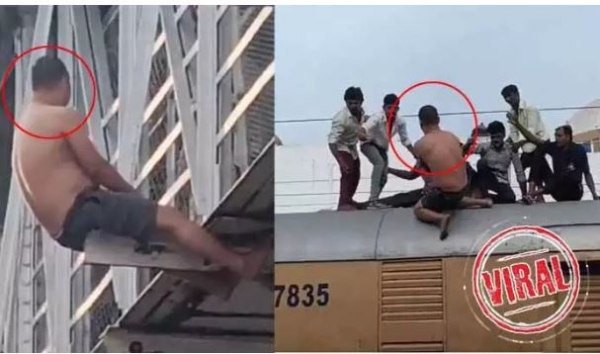 deranged-man-creates-a-scene-at-renigunta-railway-station-climbs-ont